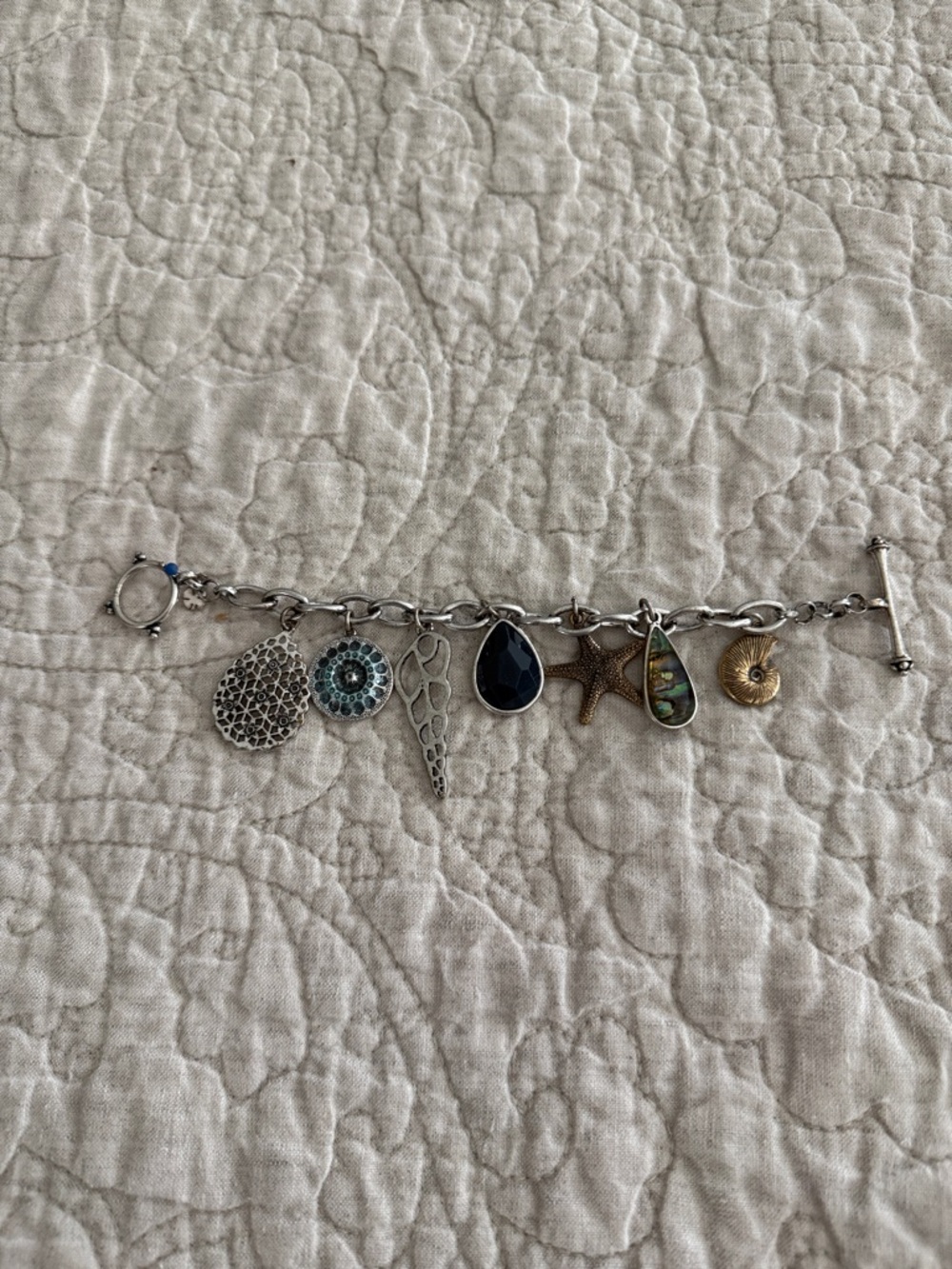 Lucky Brand Silver Charm Bracelet with Blue and Gold Accents